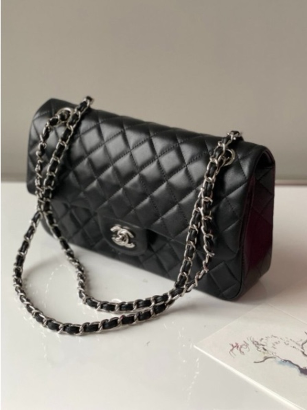 Black Quilted Shoulder Bag with Silver Chain Accent